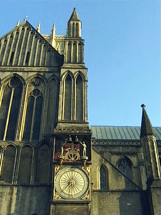 Det berømte ur, som findes udvendigt på domkirken i Wells. Mottoet betyder: 'Lad intet gå til spilde'.